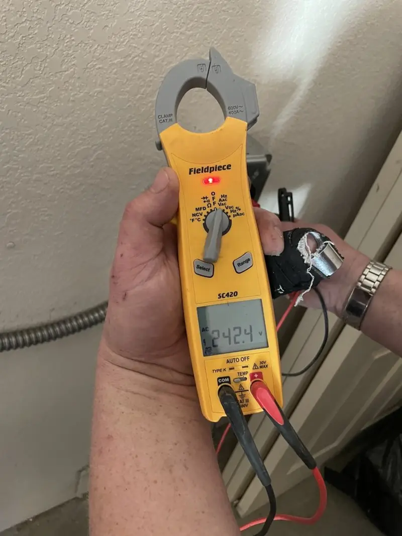Voltage testing with clamp meter during Circuit Breaker Repair in Suwanee